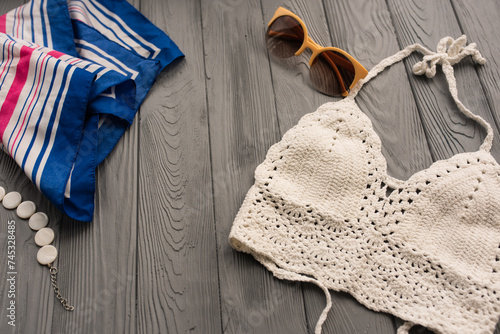 Fotografi white knitted top woman trending two-piece swimsuit beach swimwear fashion sunglasses
