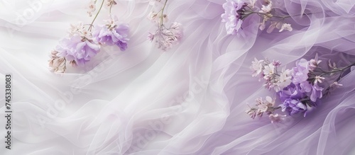 This close up showcases a lavender dress adorned with intricate, colorful flowers. The purple wedding dress features delicate details on white mesh tulle, creating an aesthetic background for the photo