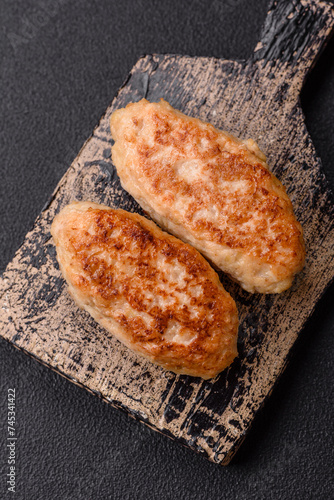 Delicious fresh fried minced fish cutlets with spices and herbs