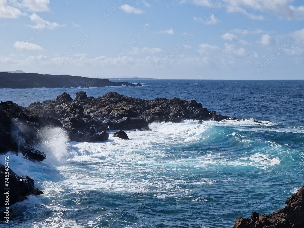 Breaking waves on the rocky shore of Lanzarote