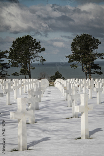 Rows and Rows -Thousands of white crosses mark the graves of fallen WWII soldiers in the American Cemetery in Normandy, France.