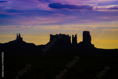 Monument Valley Sunset - The western sky frames the sacred, iconic shapes of Monument Valley