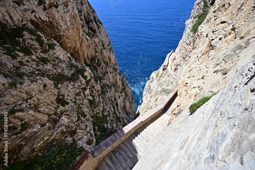 A stairway called Escala del Cabirol, cut into the cliff, leads from the top of the cliff at Capo Caccia down to the entrance to Neptune's Grotto
 photo