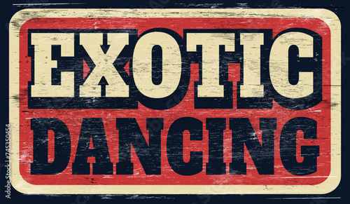 Old distressed exotic dancing sign on wood