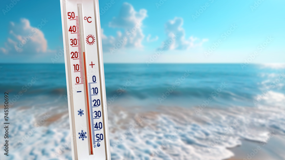The thermometer against the background of the sea shows 25 degrees - obrazy, fototapety, plakaty 