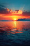 Calm ocean sunset with mountain silhouettes