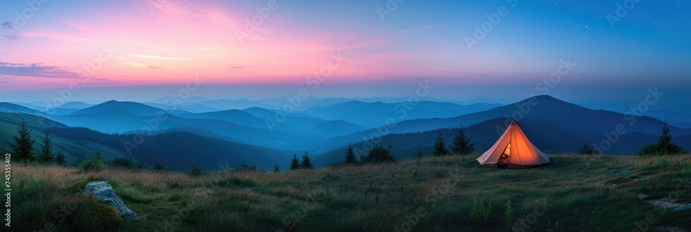 Camping under the twilight sky in the mountain wilderness