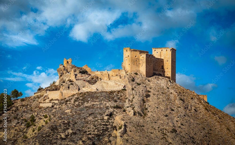 View of the impressive medieval castle of Mula, Region of Murcia, Spain, on a steep, rocky hill