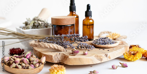 Botanical blends, herbs, essencial oils for naturopathy. Natural remedy, herbal medicine, blends for bath and tea on wooden table background