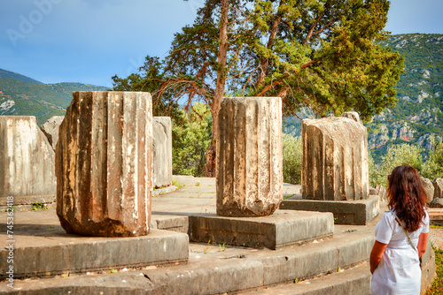 Greek history theme: Tholos with Doric columns at the sanctuary of Athena Pronoia temple ruins in ancient Delphi, UNESCO World Heritage Site, Greece. photo