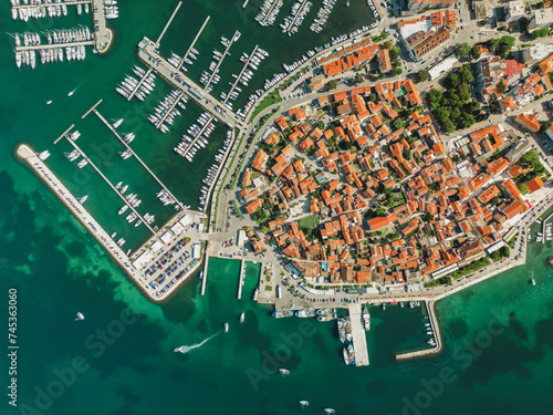 Biograd na Moru, aerial above marina view with ships and yachts at pier in row. Old European architecture in summer port, travel destination on Adriatic Sea coast, Dalmatia region of Croatia photo