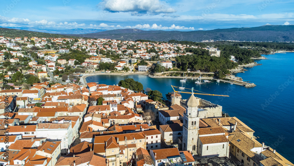 Aerial view of the enchanting town of Krk on the island of Krk in Croatia, captured from a drone.