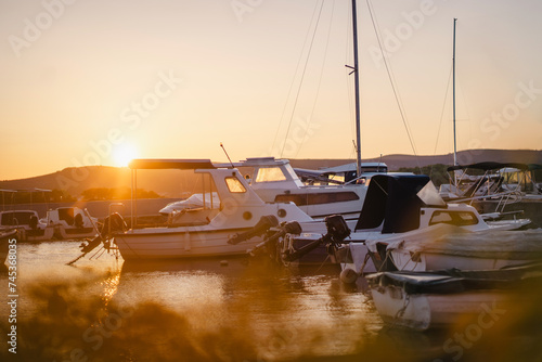 Fototapeta Naklejka Na Ścianę i Meble -  Sunset at port of Biograd na Moru port with boats and yachts, Croatia