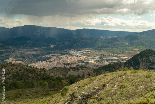 landscape with Alcoy city on background, with the storm coming