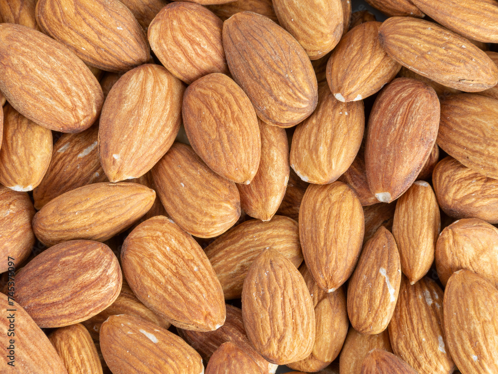 Close up with many fresh organic peeled almonds . Natural texture background. Close up with many fresh organic peeled almonds . Natural texture background.
