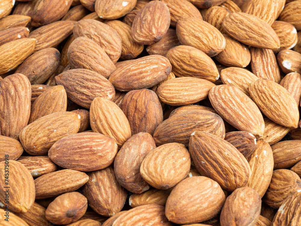 Close up with many fresh organic peeled almonds . Natural texture background. Close up with many fresh organic peeled almonds . Natural texture background.