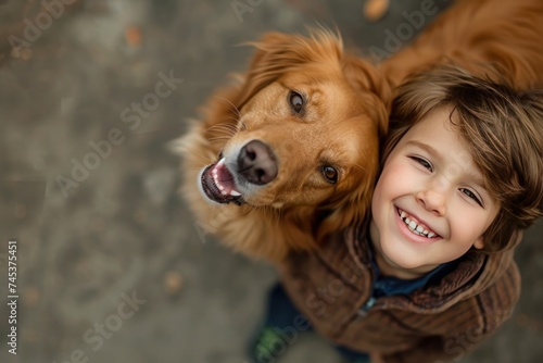 a young boy and his dog are smiling at the camera