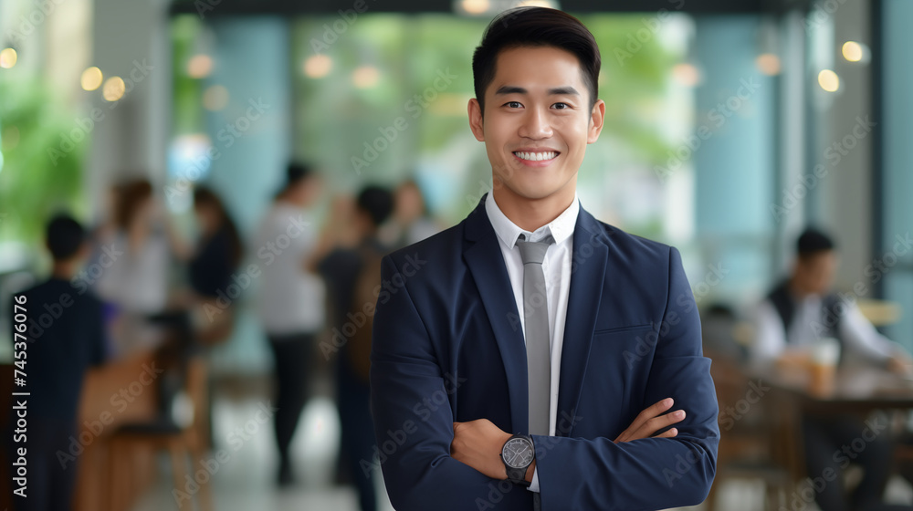 portrait of a businessman smiling with a office background 