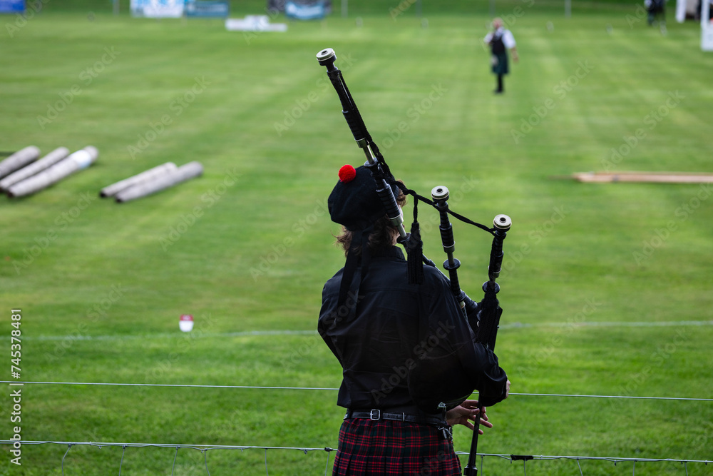 A Scottish bagpiper plays his bagpipes on the playing field of the Scottish Highland Games in the town of Crieff in Scotland A Scottish bagpiper plays his bagpipes on the playing field of the Scottish Highland Games in the town of Crieff in Scotland