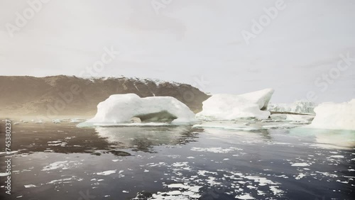 A wide low angle view of melting sea ice floes in still waters of Northern Arctic photo