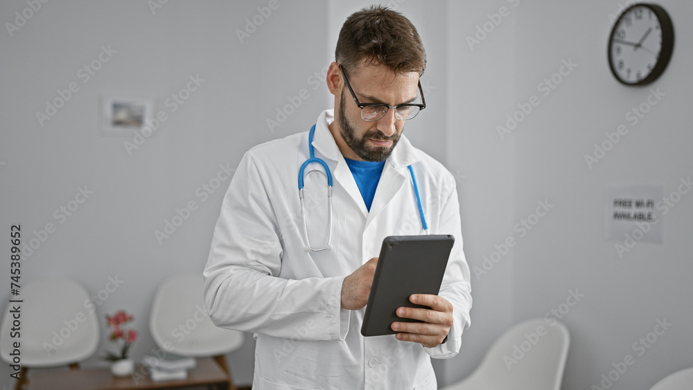 Handsome young hispanic man, a dedicated doctor, immersed in work on his touchpad, sitting relaxed yet serious in a clinic waiting room, epitome of professional healthcare. Handsome young hispanic man, a dedicated doctor, immersed in work on his touchpad, sitting relaxed yet serious in a clinic waiting room, epitome of professional healthcare.