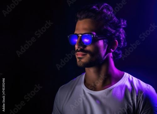 Man With Glasses Standing in Front of Purple Light © Marharyta