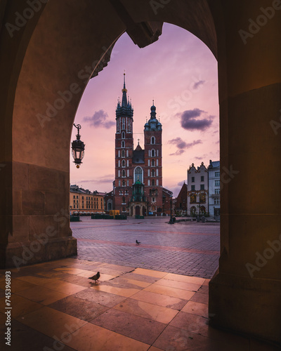 Cracow, Poland - St. Mary's Basilica on the Cracow Main Square at dusk. Beautiful Krakow old town, famous tourist attraction and travel destination