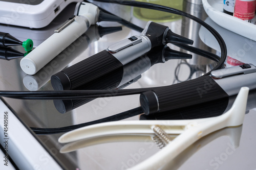 black and white photo, medical tools, tools in the otolaryngologist's office, tweezers, scissors, background top view