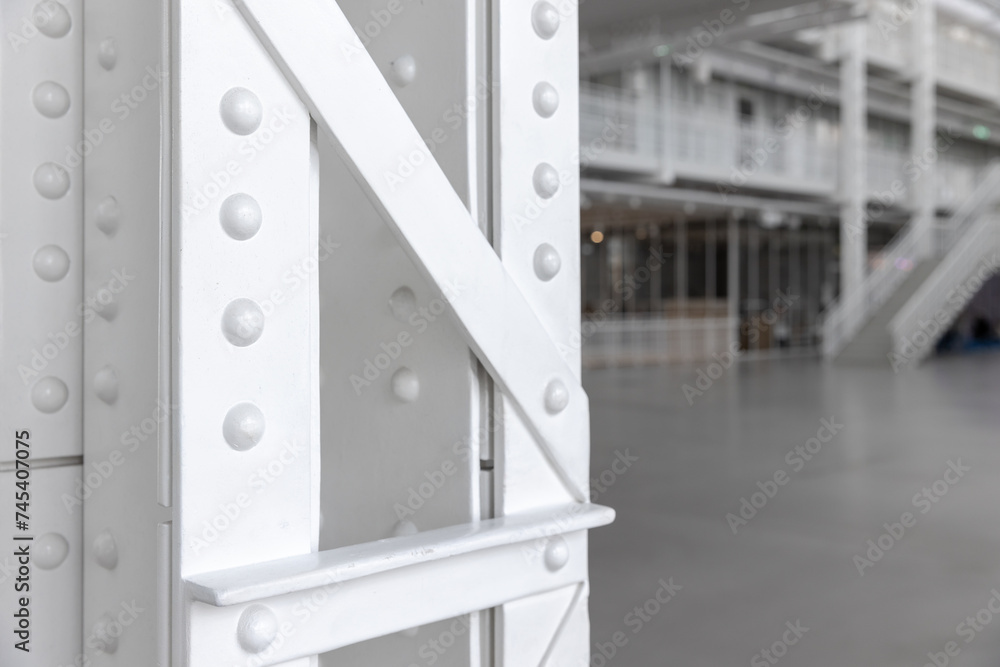 White steel truss pillar structure, close up photo, vintage industrial architecture White steel truss pillar structure, close up photo, vintage industrial architecture