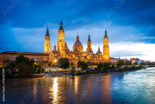 Evening landscape of the Cathedral Basilica of Our Lady of the Pillar on the banks of river Ebro in Zaragoza, Aragon, Spain with vignetting effect