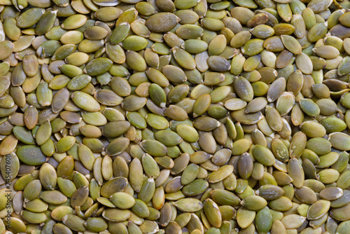 An abstract image of the texture of healthy organic dried pumpkin seeds.  © Pam Walker