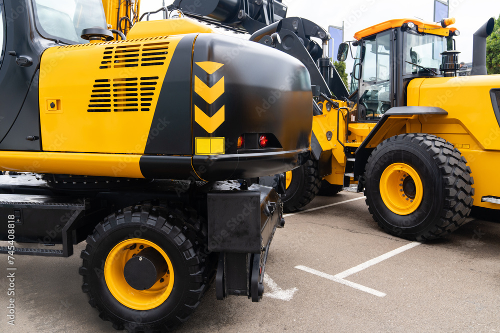 Fleet of yellow construction machines Fleet of yellow construction machines