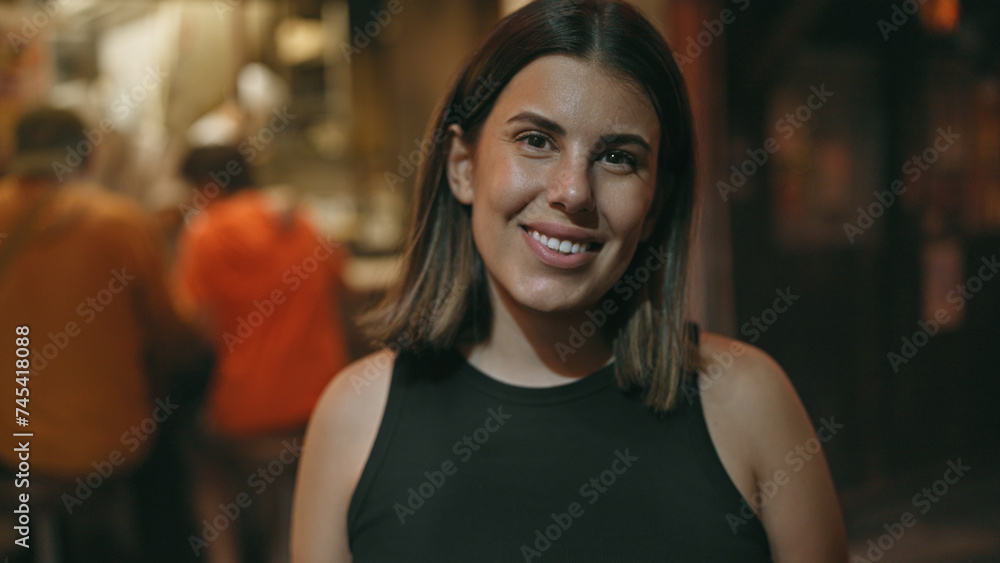 Laughing into the tokyo night, joyful, confident hispanic woman brightens shinjuku's omoide yokocho with her carefree smile. Laughing into the tokyo night, joyful, confident hispanic woman brightens shinjuku's omoide yokocho with her carefree smile.