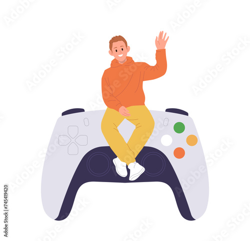 Happy guy tiny cartoon character sitting on huge game console isolated on white background