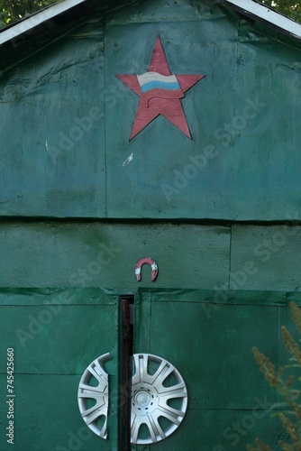 green russian shed with flag