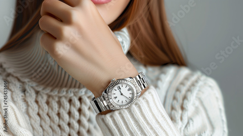 Stylish golden white classic watch on woman hand photo