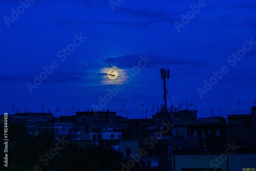 Full moon in the blue sky