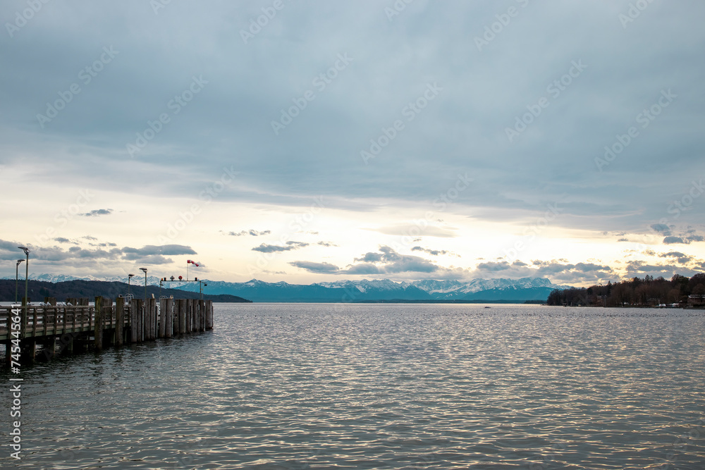 Lake Starnberg in Bavaria, Germany. Pier with the Alps mountains in the background