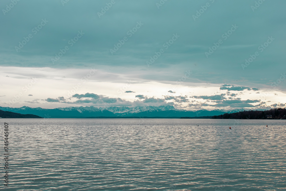 View of Lake Starnberg in Bavaria and the Alps. Lake Starnberg with the Alps in the background