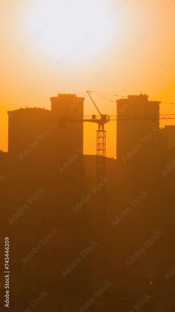 Timelapse, vertical slider video: dramatic sunset sky with the setting sun and moving clouds over Istanbul, Turkey - buildings and cranes silhouettes, getting darker. Time lapse and cityscape concept Timelapse, vertical slider video: dramatic sunset sky with the setting sun and moving clouds over Istanbul, Turkey - buildings and cranes silhouettes, getting darker. Time lapse and cityscape concept