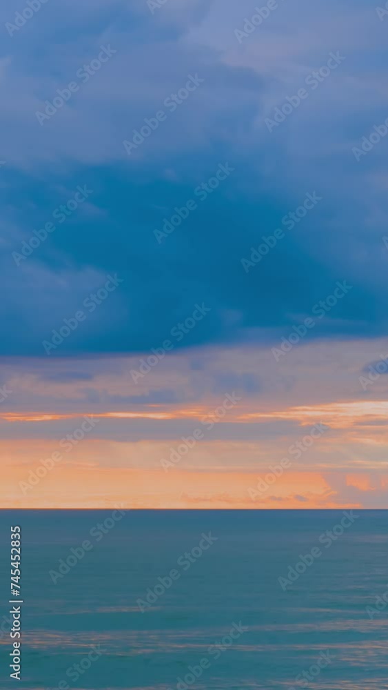 Timelapse, vertical video: amazing dramatic sunset over the Black Sea surface in the evening. Moving clouds in the sky - getting darker. Cloudscape, abstract, summer, nature and time lapse concept Timelapse, vertical video: amazing dramatic sunset over the Black Sea surface in the evening. Moving clouds in the sky - getting darker. Cloudscape, abstract, summer, nature and time lapse concept