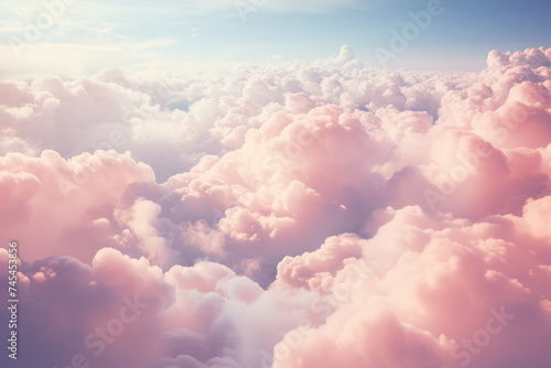 A mesmerizing view of fluffy white clouds floating gracefully in the sky as seen from the window of a plane