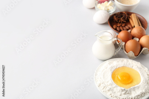 Composition with different ingredients for preparing bakery on light background