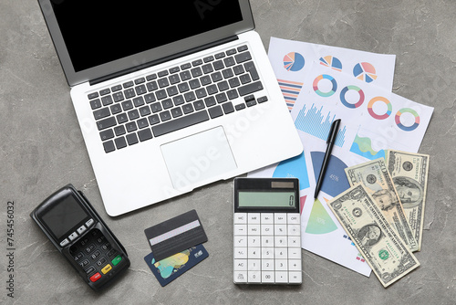 Laptop, calculator, money a...
