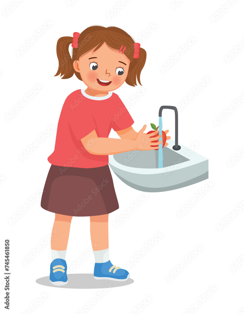 Cute little girl washing apple fruit at the sink Cute little girl washing apple fruit at the sink