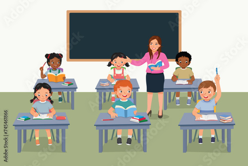 Young female teacher teaching students in the classroom