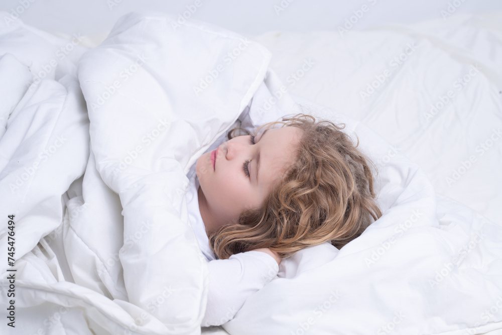 Kid enjoying sweet dreams. Child sleeping in bed. Cute kid sleeping under blanket. Kid lying on pillow. Child rest asleep, enjoy healthy sleep or nap. Kid enjoying sweet dreams. Child sleeping in bed. Cute kid sleeping under blanket. Kid lying on pillow. Child rest asleep, enjoy healthy sleep or nap.