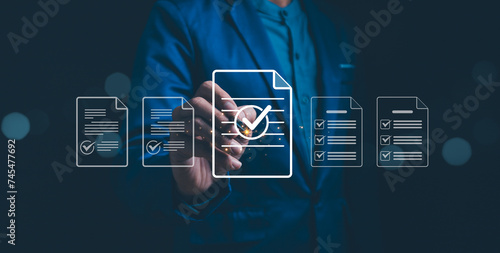 Obraz na płótnie A professional interacts the interface of checkmarked documents, signifying futuristic data management. Verifying the validity, approving requests, quality assurance, Online digital document work. w salonie