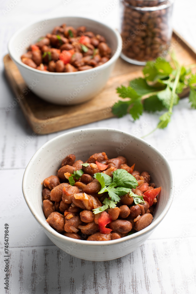 Vegetarian dish of stewed pink beans and tomatoes. A delicious bean dish served Vegetarian dish of stewed pink beans and tomatoes. A delicious bean dish served