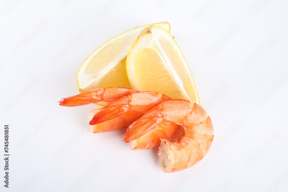 Delicious cooked shrimps and lemon isolated on white